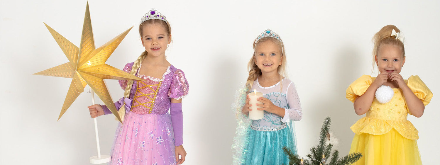 meitenes princešu svētku kleitās violetā zilā un dzeltenā