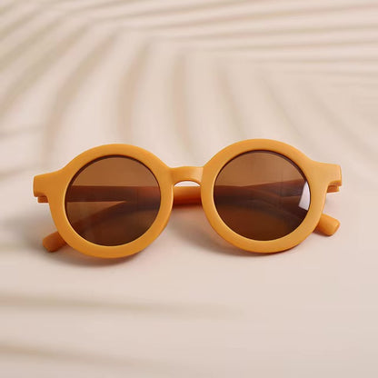 saulesbrilles bērniem apaļas oranžas
